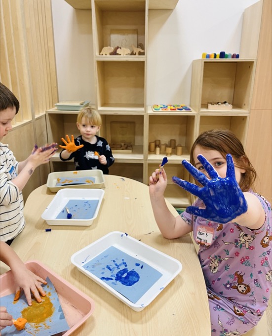 Children at a hands-on painting activity at Boogles Playhouse
